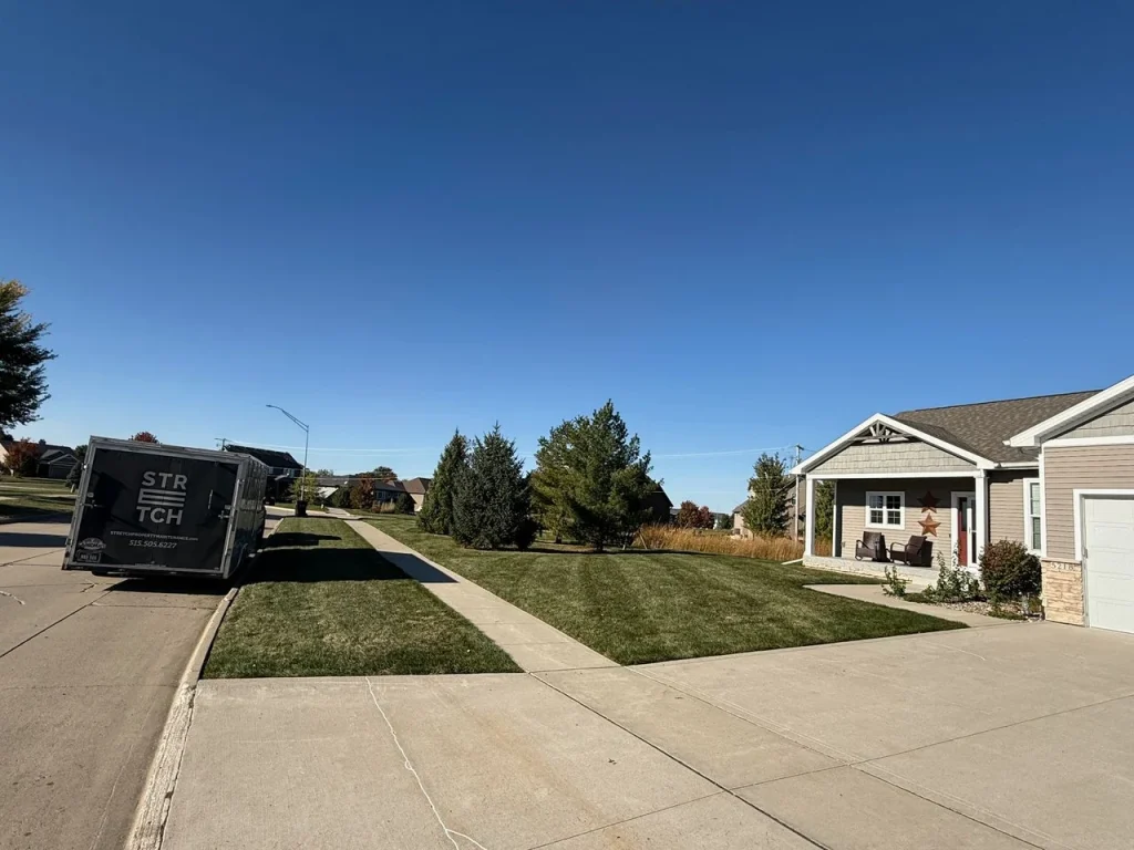 Stretch Property Maintenance performed weekly mowing at residential home in Cherry Glen Estates neighborhood in Ankeny, IA